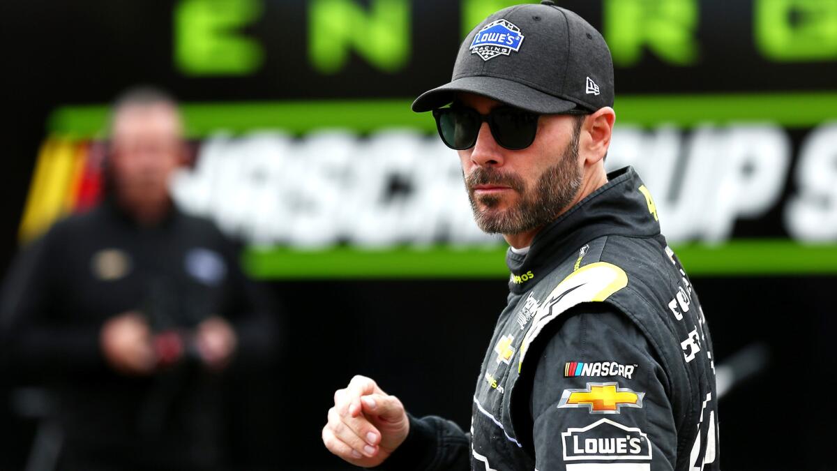 Jimmie Johnson leaves the inspection area during qualifying at Auto Club Speedway on Friday.