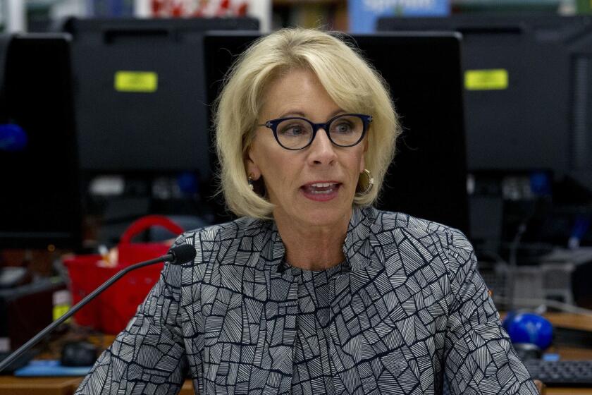 FILE - In this May 31, 2018 file photo, Education Secretary Betsy DeVos speaks during a visit of the Federal School Safety Commission at Hebron Harman Elementary School in Hanover, Md. DeVos says she has "no intention of taking any action" regarding any possible use of federal funds to arm teachers or provide them with firearms training. Her comments came Friday, Aug. 31, 2018 after a top official in her department, asked about arming teachers, said states and local jurisdictions always "had the flexibility" to decide how to use federal education funds. (AP Photo/Jose Luis Magana, File)