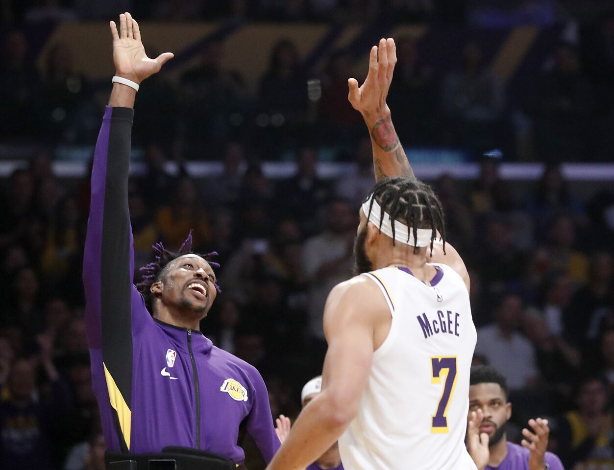Lakers big men Dwight Howard, left, and JaVale McGee celebrate after a basket by McGee.