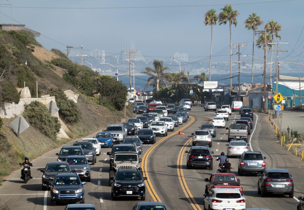 Pacific Coast Highway in Pacific Palisades is crowded with afternoon traffic.