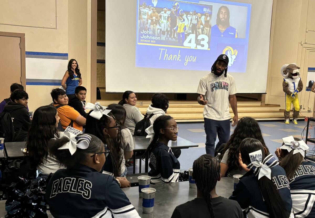 Rams safety John Johnson III talks to kids at the Edwin Markham Middle School in Watts.