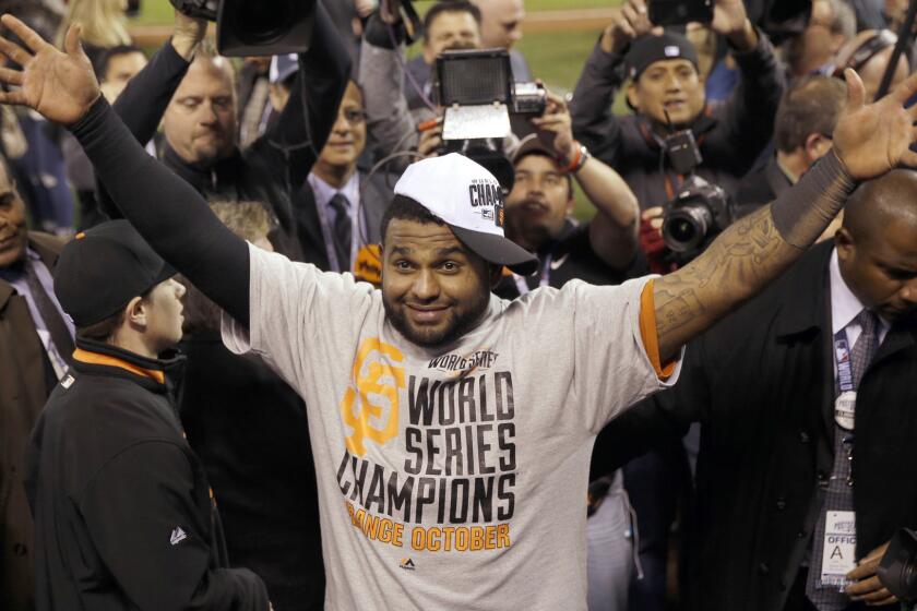 San Francisco Giants third baseman Pablo Sandoval celebrates the team's World Series victory over the Kansas City Royals.