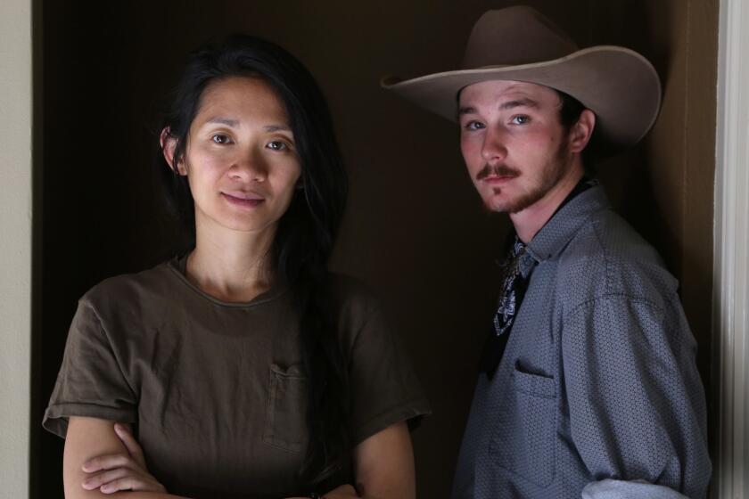 BEVERLY HILLS, CA-April 11, 2018: Director Chloe Zhao, left, and actor and former bronco rider Brady Jandreau, right, of the critically acclaimed indie drama "The Rider," are photographed at the Four Seasons Hotel in Beverly Hills. The film centers on a rodeo rider trying to recover from a life-threatening injury and features a cast of non-actors.(Katie Falkenberg / Los Angeles Times)