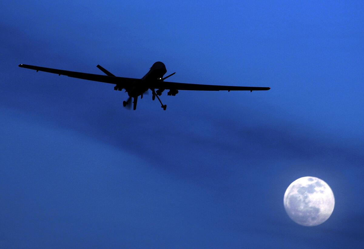 A U.S. Predator drone flies over southern Afghanistan on a moonlit night in January 2010. The Obama administration is amending its rules to allow export of armed military drones to friendly nations.