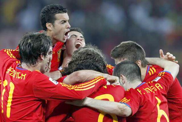 Players for Spain celebrate after taking a 1-0 lead late in their World Cup semifinal match against Germany on Wednesday.