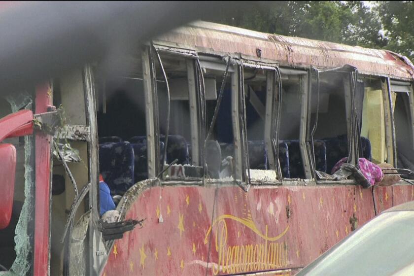 A damaged bus is shown after several people were killed and dozens injured after the commercial bus overturned on Interstate 20 early Saturday, Aug. 31 2024 in Warren County, Miss., according to the Mississippi Highway Patrol. (WAPT via AP)