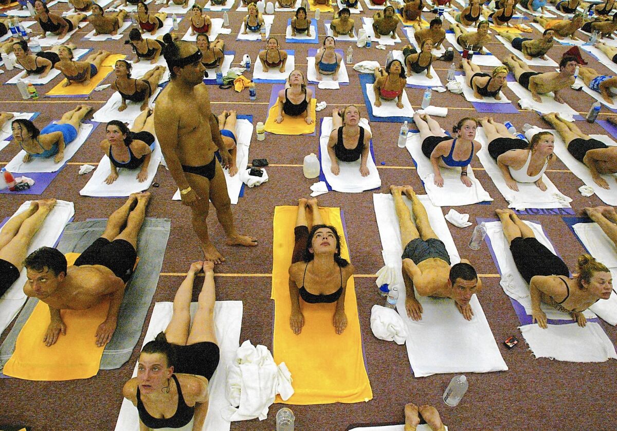 Bikram Choudhury leads students at the Bikram Yoga College of India in Los Angeles in 2002.