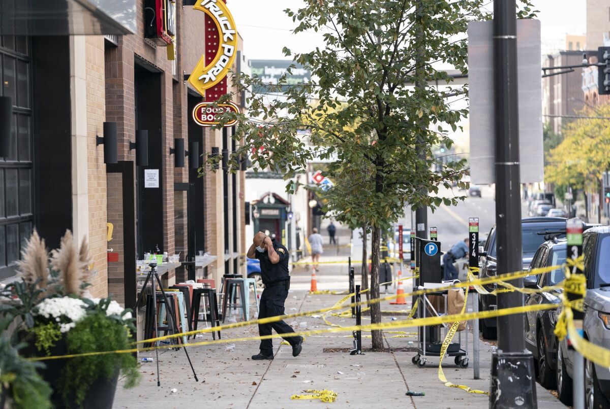 Investigators processed the chaotic scene of a multiple shooting at the bar Truck Park in St. Paul, Minn., that happened after midnight on Sunday, Oct. 10, 2021. (Renee Jones Schneider/Star Tribune via AP)