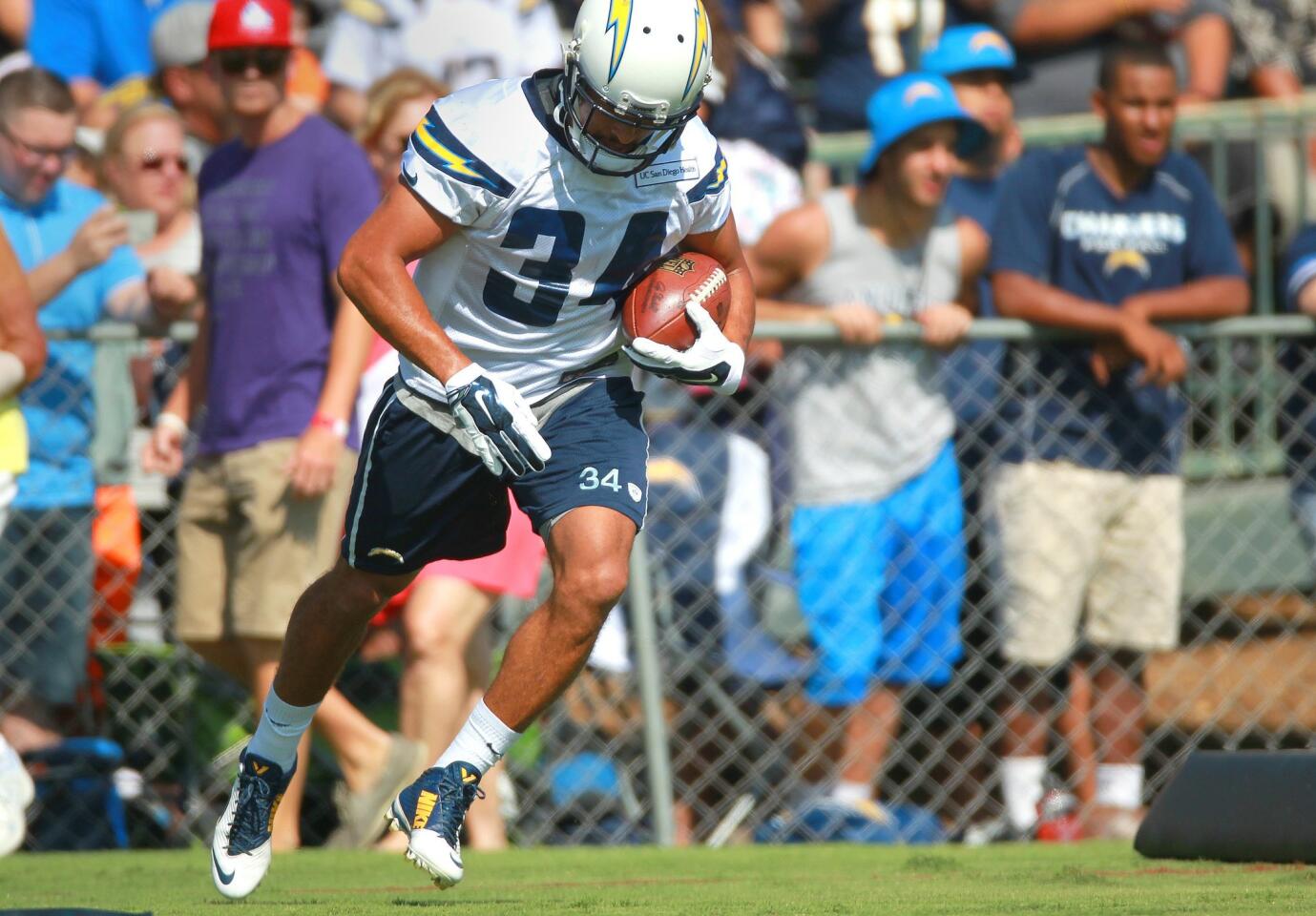 Chargers running back Danny Woodhead runs on the field at Chargers Park on the first day of camp.