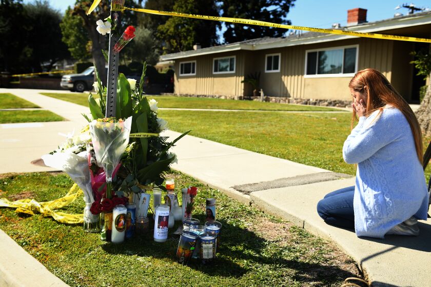 Hacienda Heights, California February 19, 2023- Kristina Provencio sheds tears as kneels near the house where Bishop David O'Connell was murdered in Hacienda Heights. (Wally Skalij/(Los Angeles Times)