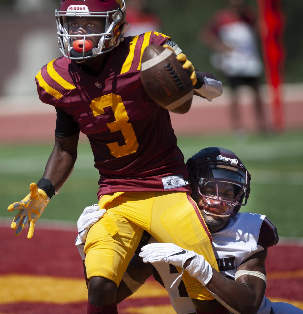 Glendale Community College’s Jalen Lawrence runs in the touchdown while being held by Antelope Valley College’s Jaylen Sargent during Saturday's game at GCC. (Photo by Miguel Vasconcellos)