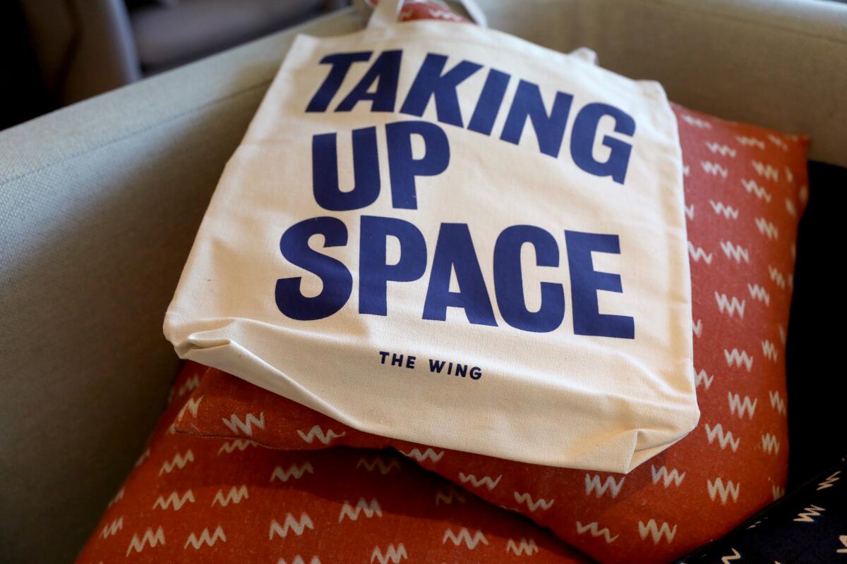 A tote bag with the message, "Taking Up Space"