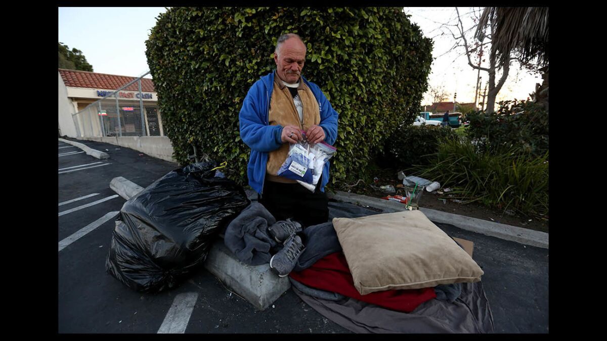 John Wagner holds a City Net care package given to him in Costa Mesa.