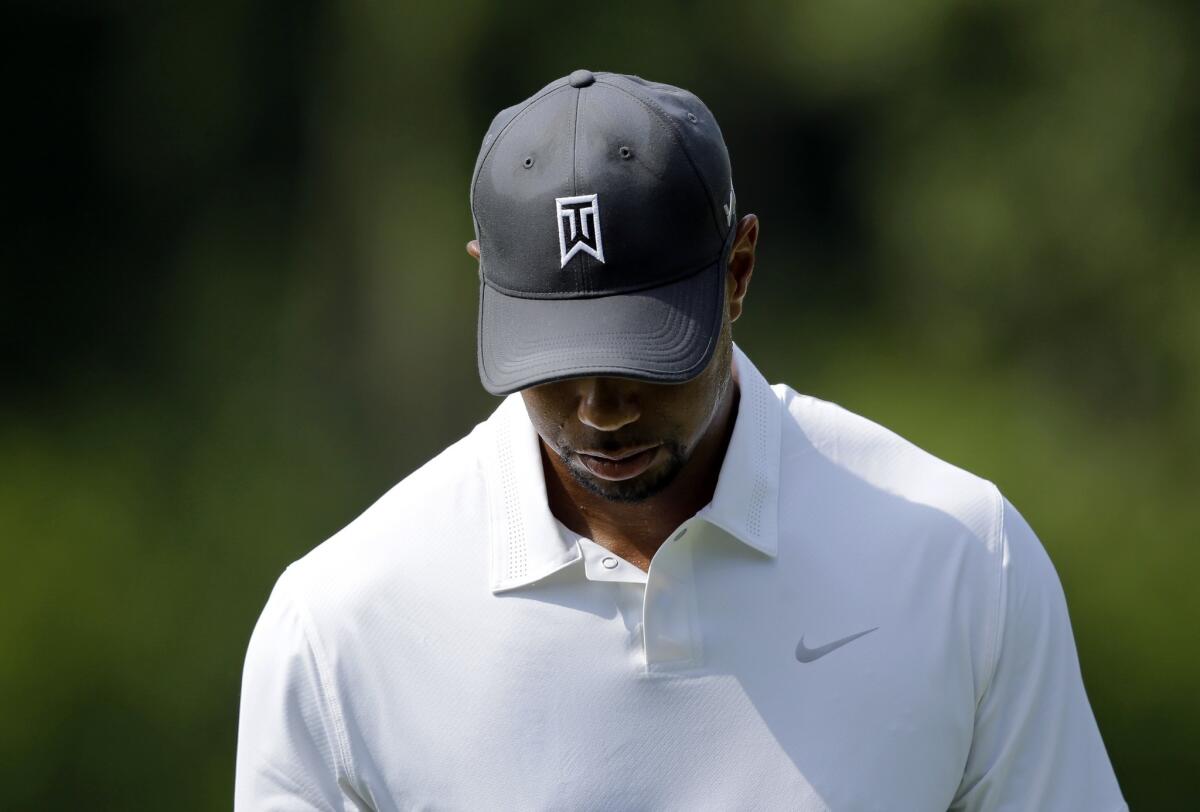 Tiger Woods missed the cut at Congressional after shooting a 74-75 in his first tournament in over three months.