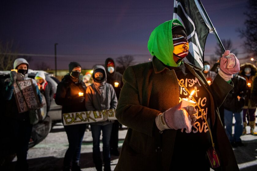 A vigil is held for Andre' Hill at the Brentnell Community Recreation Center on Columbus. Ohio, Saturday, Dec. 26, 2020. The police chief of Columbus, Ohio, recommended on Thursday, Dec. 24, 2020, that the officer who shot and killed Hill, a 47-year-old Black man, earlier this week be fired. (Gaelen Morse/The Columbus Dispatch via AP)