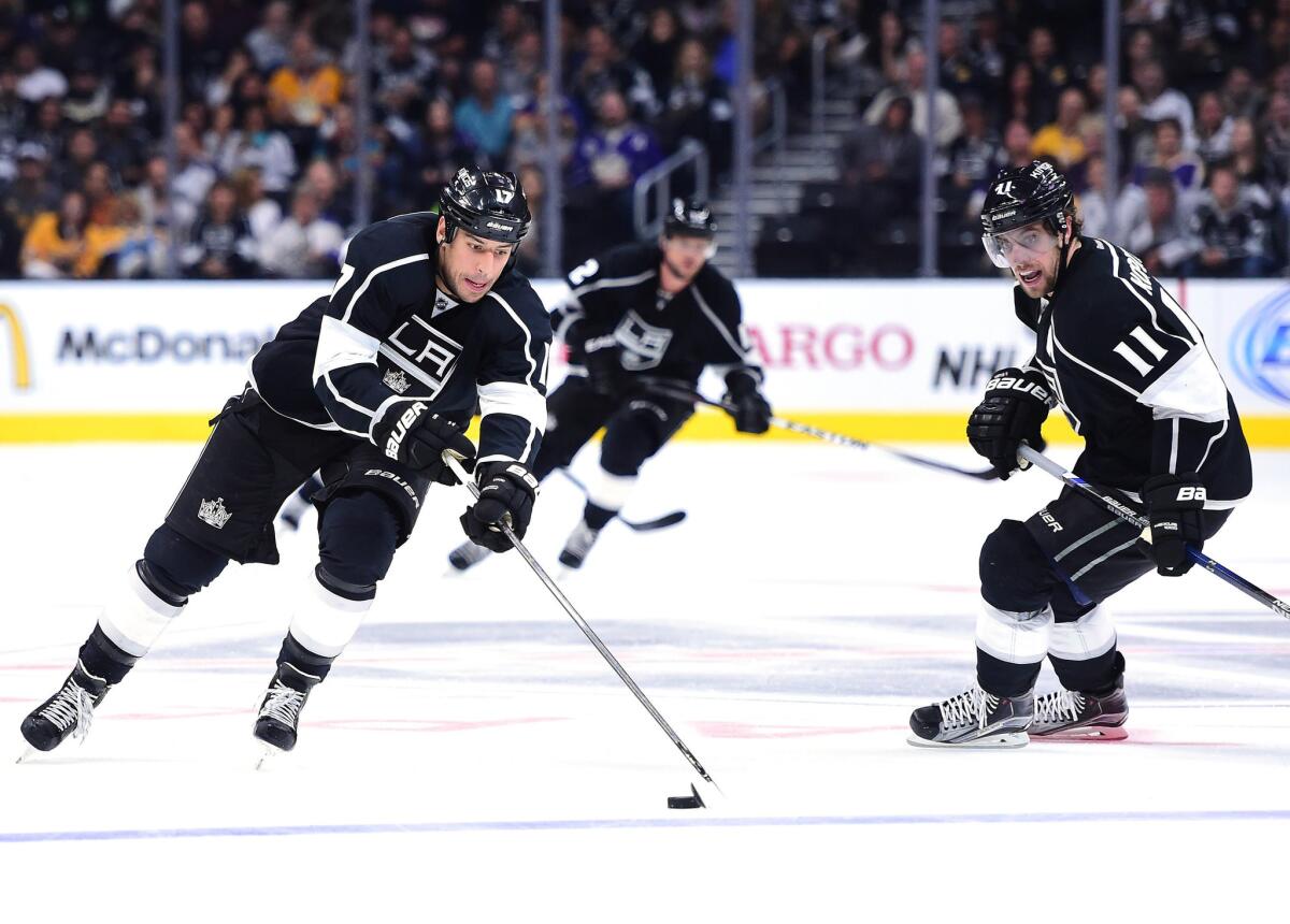 Kings forwards Milan Lucic (17), Anze Kopitar (11) and Marian Gaborik (12) work up the ice against the Arizona Coyotes during the second period of a preseason game Tuesday.