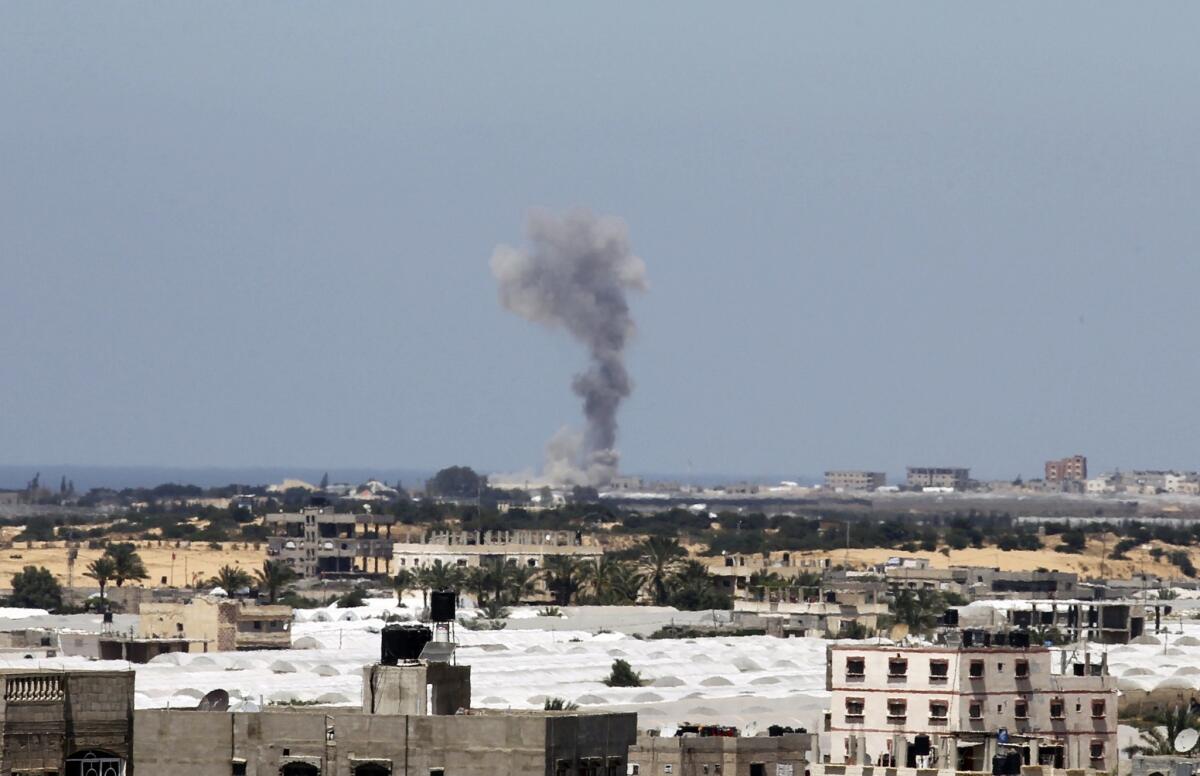 Smoke rises following an Israeli strike Monday on Rafah in the southern Gaza Strip, hours after Palestinian militants in the coastal enclave fired seven rockets into Israel, causing no casualties.