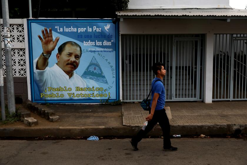 MANAGUA, NICARAGUA -- MONDAY, FEBRUARY 10, 2020: Daniel Ortega, President of Nicaragua since 2007, mural at the Minister of Agriculture building in Nicaragua on Feb. 10, 2020. For 75-months President Daniel Ortega's autocratic regime had been holding up in General Directorate of Customs (DGA) roughly half a million dollars of La Prensa’s, in publication for 93-years, two most essential ingredients: paper and ink. (Gary Coronado / Los Angeles Times)