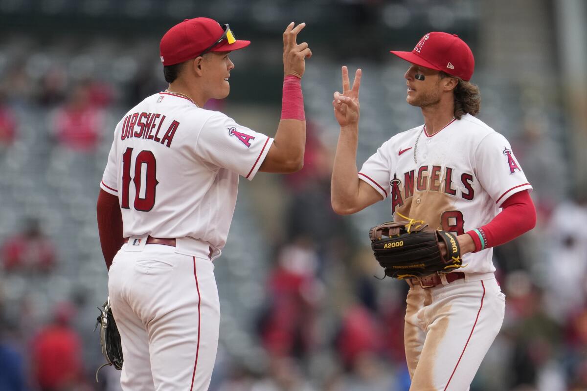 The Angels' Gio Urshela and Brett Phillips celebrate the team's 3-2 win over the Washington Nationals 