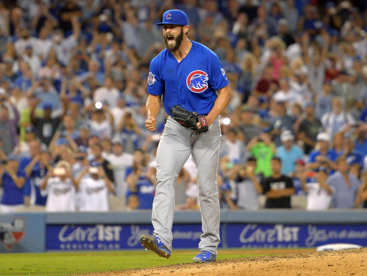 Cubs starting pitcher Jake Arrieta reacts after throwing his first career no-hitter, beating the Dodgers, 2-0.