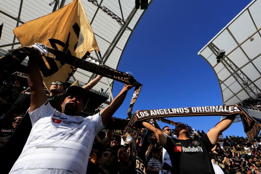 LOS ANGELES, CALIFORNIA - APRIL 21: Fans of Los Angeles FC cheer during the first half of a game between the Seattle Sounders and the Los Angeles FC at Banc of California Stadium on April 21, 2019 in Los Angeles, California. (Photo by Sean M. Haffey/Getty Images) ** OUTS - ELSENT, FPG, CM - OUTS * NM, PH, VA if sourced by CT, LA or MoD **