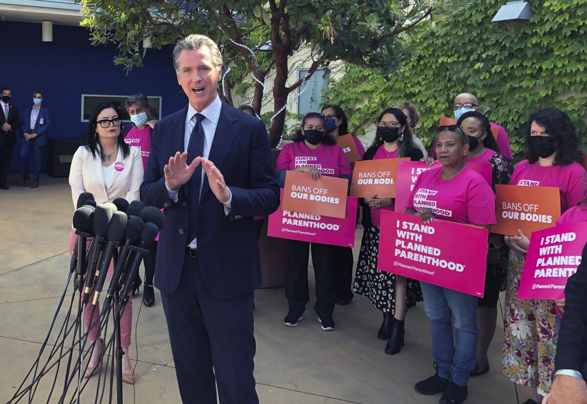 Gov. Gavin Newsom speaks at a news conference with workers and volunteers at a Planned Parenthood office.