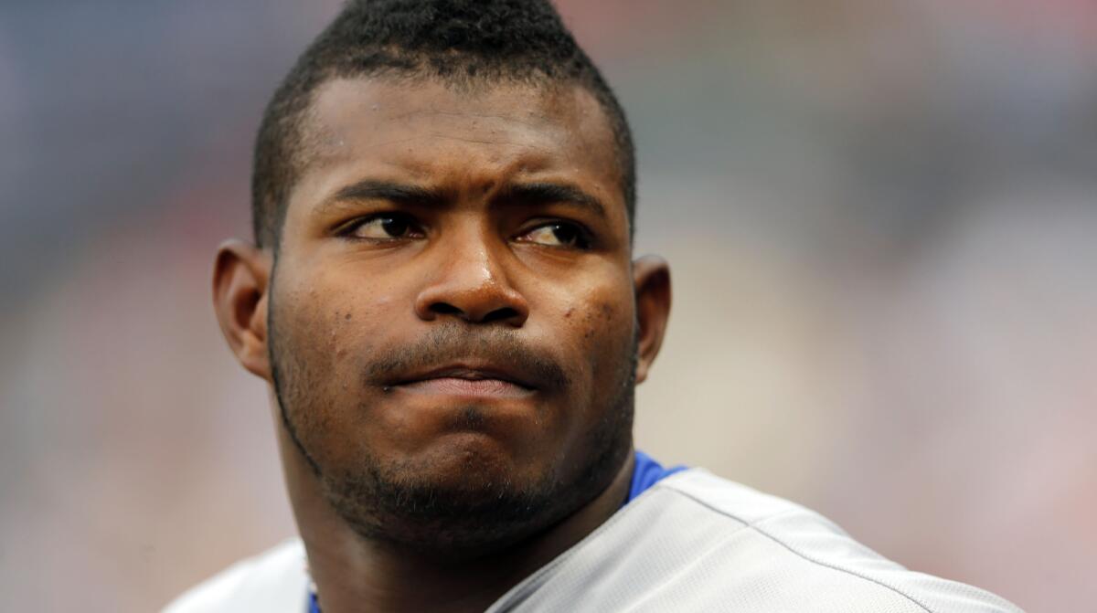 Yasiel Puig looks on from the dugout on July 20.