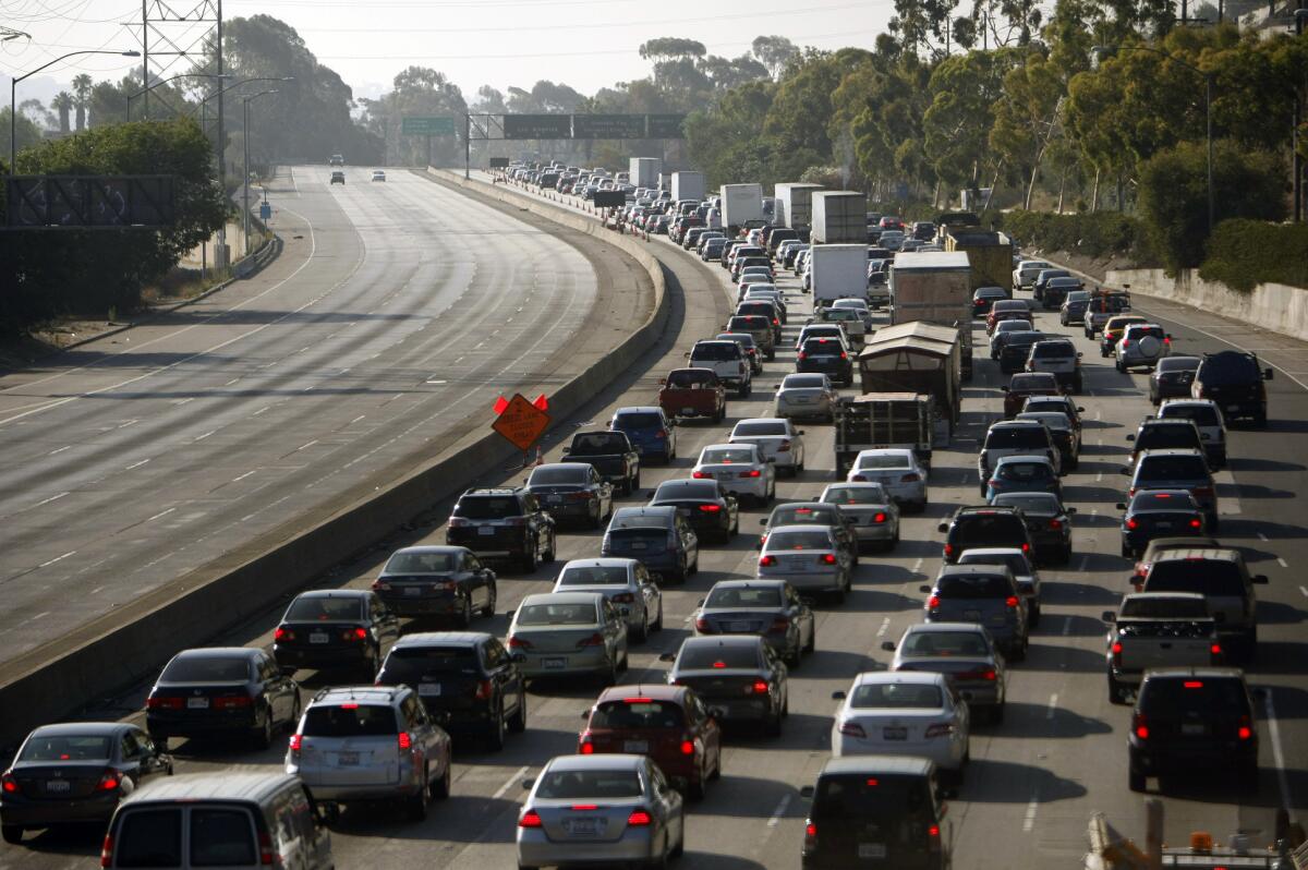 A view from the Glendale Boulevard bridge of traffic backed up on the southbound 5 Freeway on Monday morning is shown.