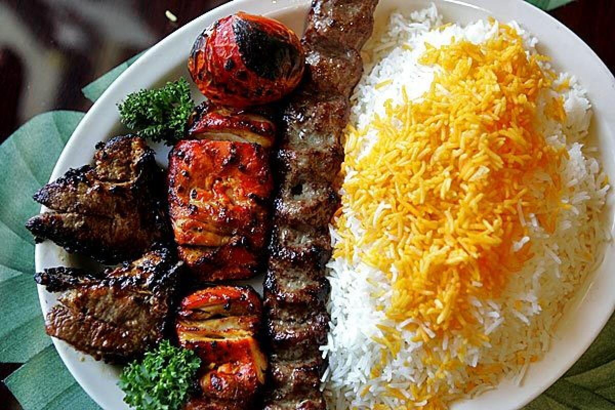 A combo dish with a boneless chicken kebab, one strip of charbroiled ground beef and two pieces of charbroiled lamb chop at House of Kabob in Lake Forest.