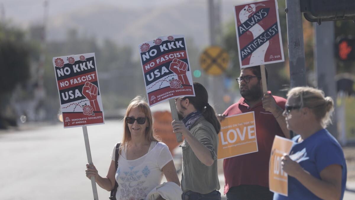 A group of anti-fascist demonstrators counter a small group of anti-Sharia demonstrators at the site of the 2015 terrorist massacre in San Bernardino.