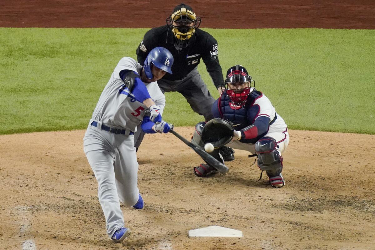 Dodgers shortstop Corey Seager hits two-run home run during the seventh inning of Game 5 of the NLCS.