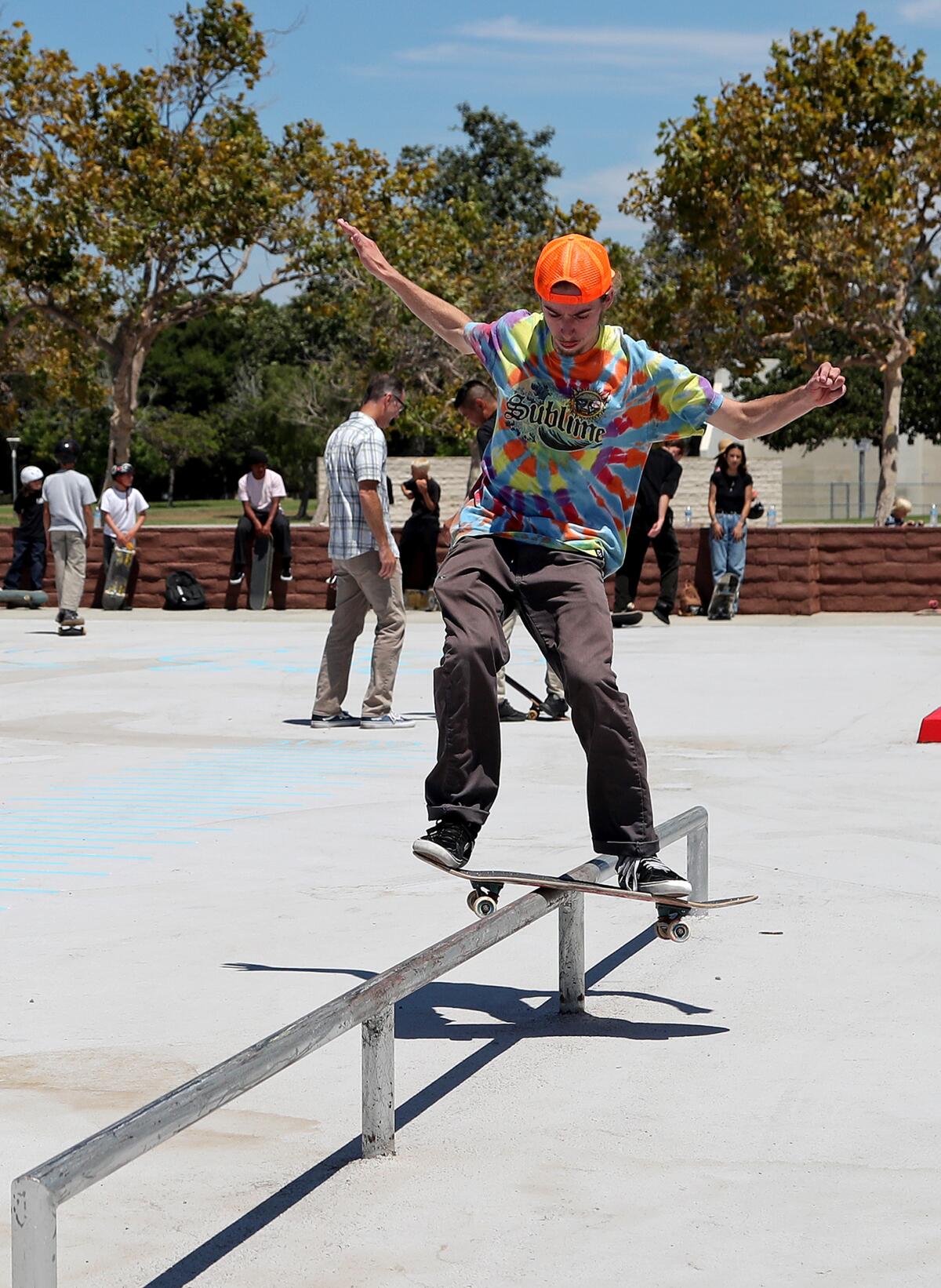 Tyler Christensen, 21, boardslides a rail at the new Edison Park Skate Spot on Thursday in Huntington Beach.