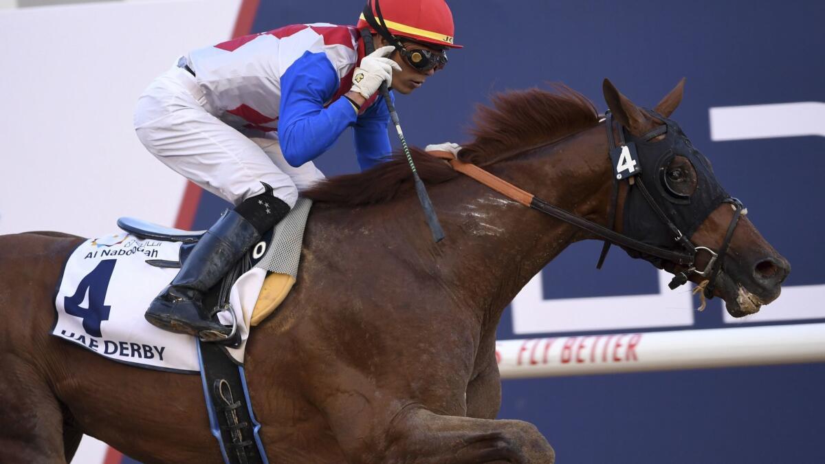 Jockey Jose Ortiz guides Plus Que Parfait to victory in the $2.5 million UAE Derby on Saturday.