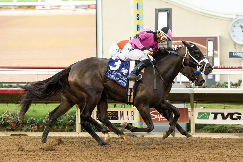 Peter Redekop's And Tell Me Nolies and jockey Ramon Vazquez, outside, get up to beat Home Cooking and Mike Smith (inside) in the Grade I $300,000 TVG Del Mar Debutante Saturday, September 10, 2022 at Del Mar Thoroughbred Club, Del Mar, CA. Benoit Photo