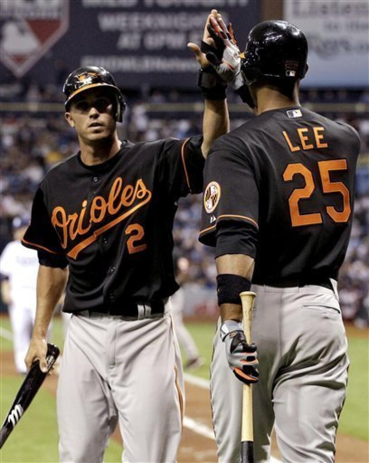 Baltimore Orioles shortstop J.J. Hardy (2) slides into third base