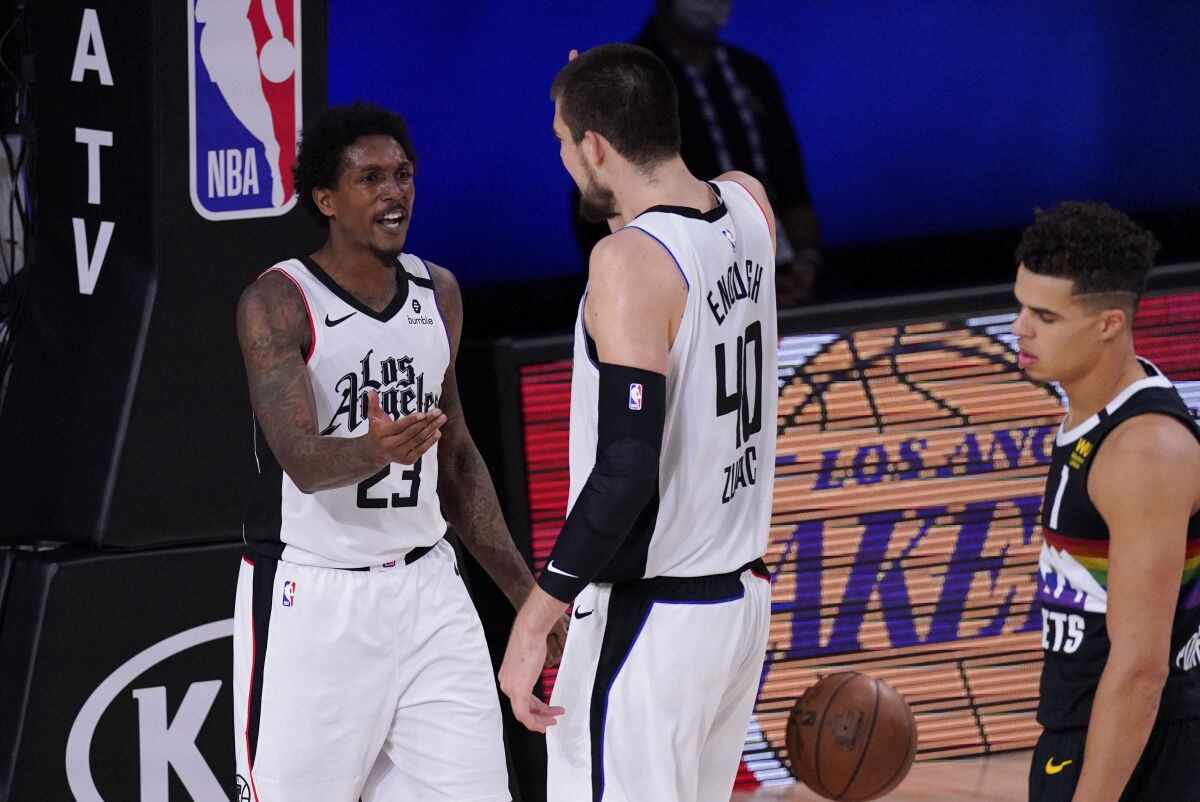 Clippers guard Lou Williams is congratulated by teammate Ivica Zubac (40) after drawing a foul while scoring in Game 4.