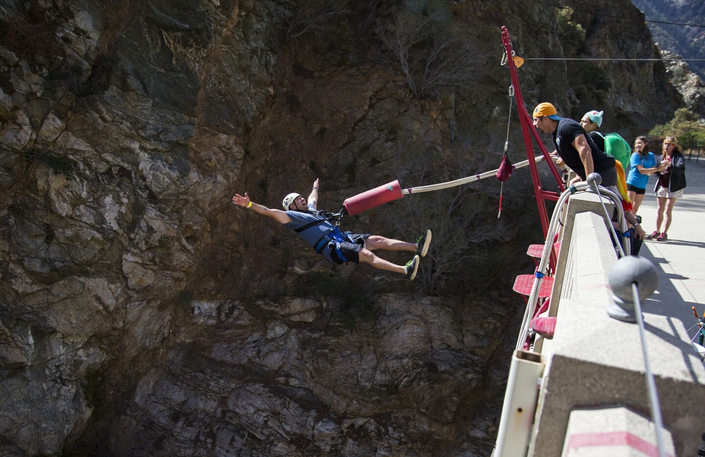 A bungee jumper does a backward plunge off the Bridge to Nowhere in 2016.
