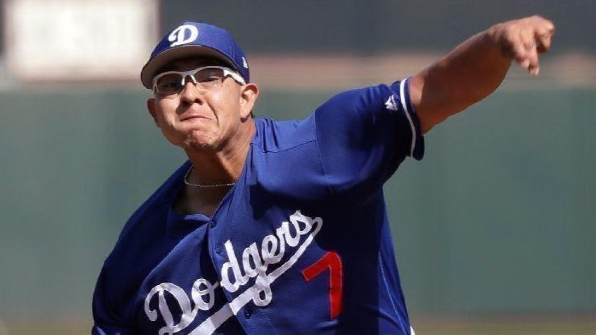 Julio Urias, shown pitching against San Francisco on March 4, threw three scoreless innings against Colorado on Sunday.