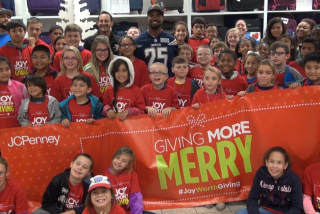 Chargers safety Darrell Stuckey shops with kids from Armed Services YMCA