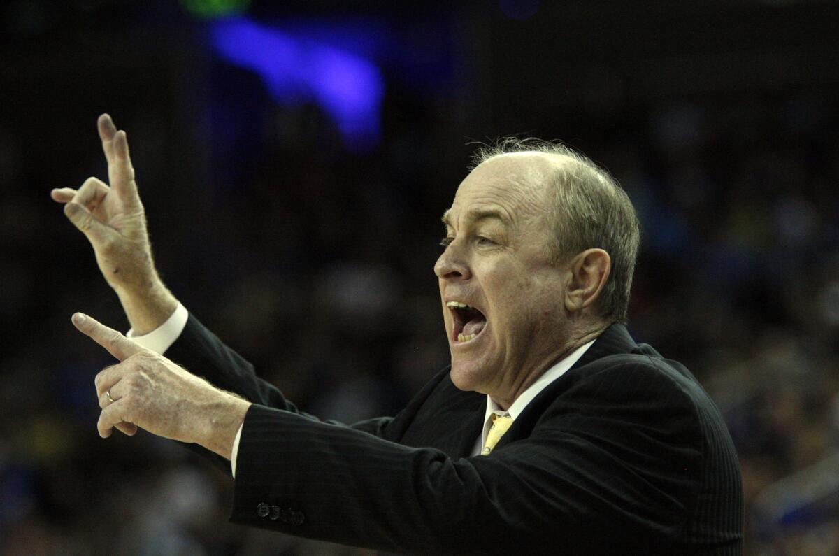 Former UCLA Coach Ben Howland shouts instruction to the Bruins in 2013.