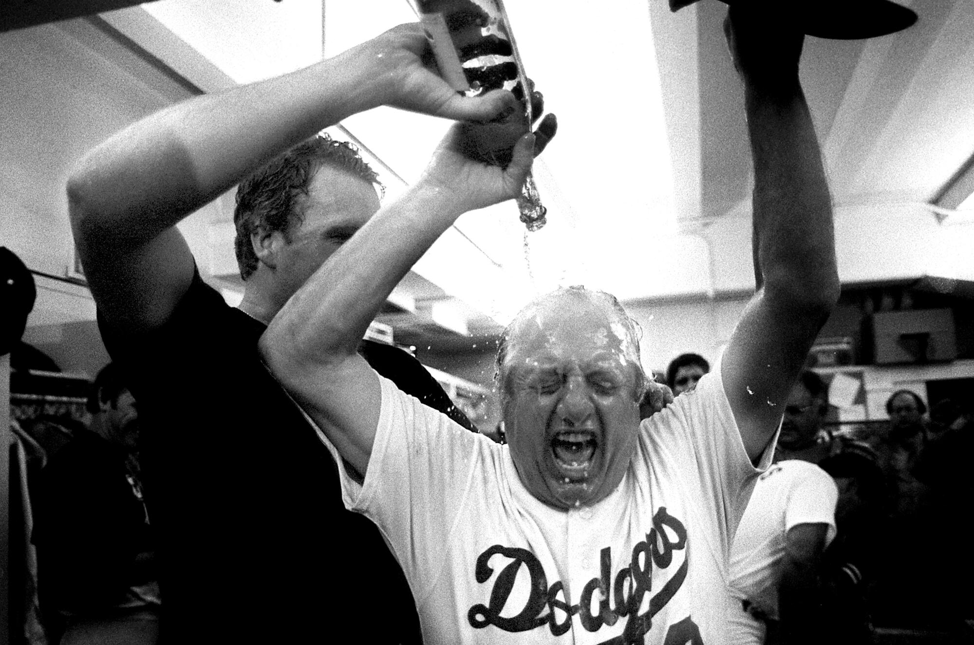 Tom Niedenfuer pours champagne on Tommy Lasorda after Dodgers won 1981 National League Division Series against Houston. 