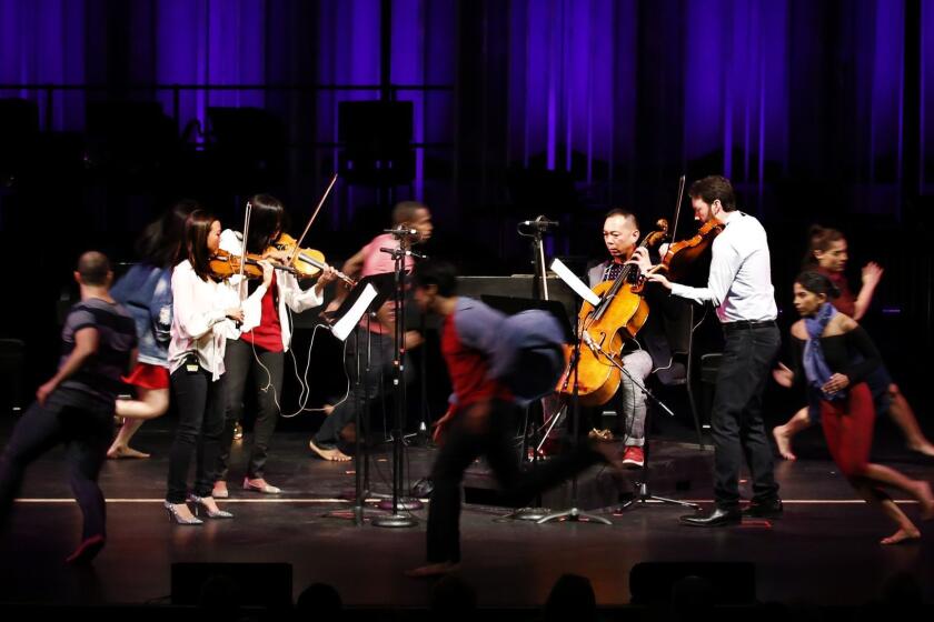 Northridge January 14, 2017: The Lyris Quartet Alyssa Park, (left-right) Shalini Vijayan, Timothy Loo, Luke Maurer surrounded by dancers during performance at Valley Center for the Performing Arts, Cal State Northridge, Northridge, CA January 14, 2017. The Jacaranda music program is presenting the Lyris Quartet accompanied by dancers and actors in a Creole, jazz and ragtime celebration of noted composer John Adams, who is seeing nationwide tributes timed to his 70th birthday. (Francine Orr/ Los Angeles Times