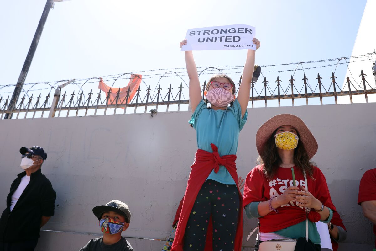 People gather during a rally in Koreatown Saturday.
