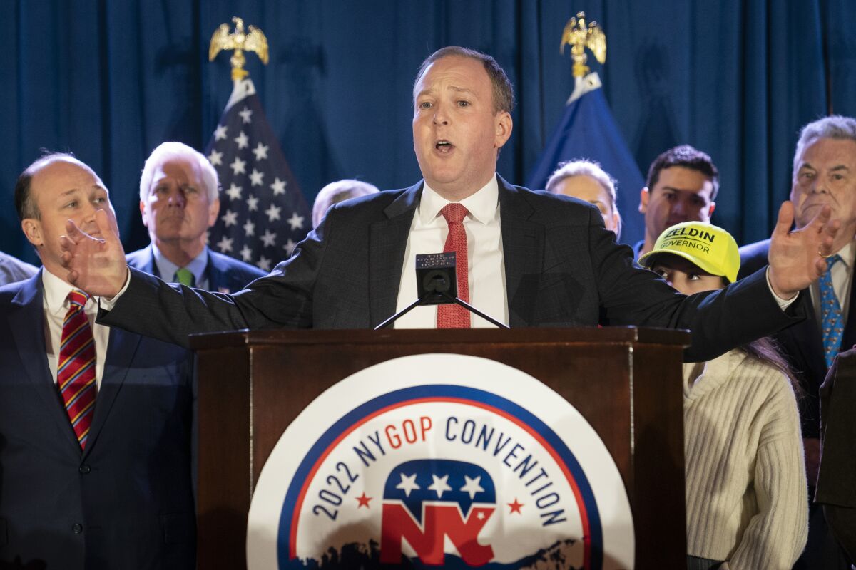U.S. Rep. Lee Zeldin speaks to delegates and assembled party officials at the 2022 NYGOP Convention, Tuesday, March 1, 2022, in Garden City, N.Y. Republicans from across New York met Tuesday to choose their gubernatorial nominee to run against Gov. Kathy Hochul in November. The GOP nominated Zeldin, of Long Island, as the party's designee for this year's gubernatorial race. (AP Photo/John Minchillo)