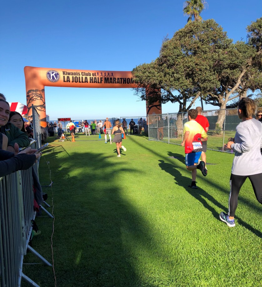 Runners head to the finish line during the La Jolla Half Marathon and La Jolla Shores 5K in December.