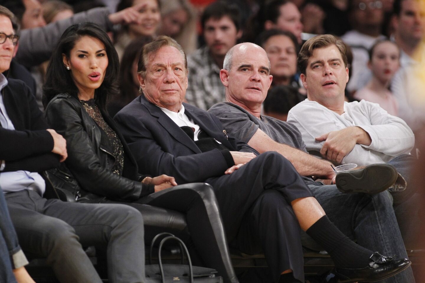 Los Angeles Clippers owner Donald Sterling, right, and V. Stiviano, left, watch the Clippers play the Los Angeles Lakers during an NBA preseason game in December 2010.