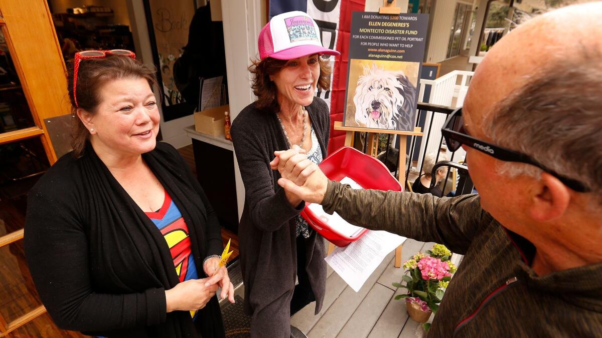 Alison Hardey, middle, owner of Jeannine's Bakery in Montecito and resident Poppy Popowich, left, thank Ron Blitzer, who organized the 93108Fund which is organizing donations for local hourly wage earners who have lost income because of the fire and mud closures.