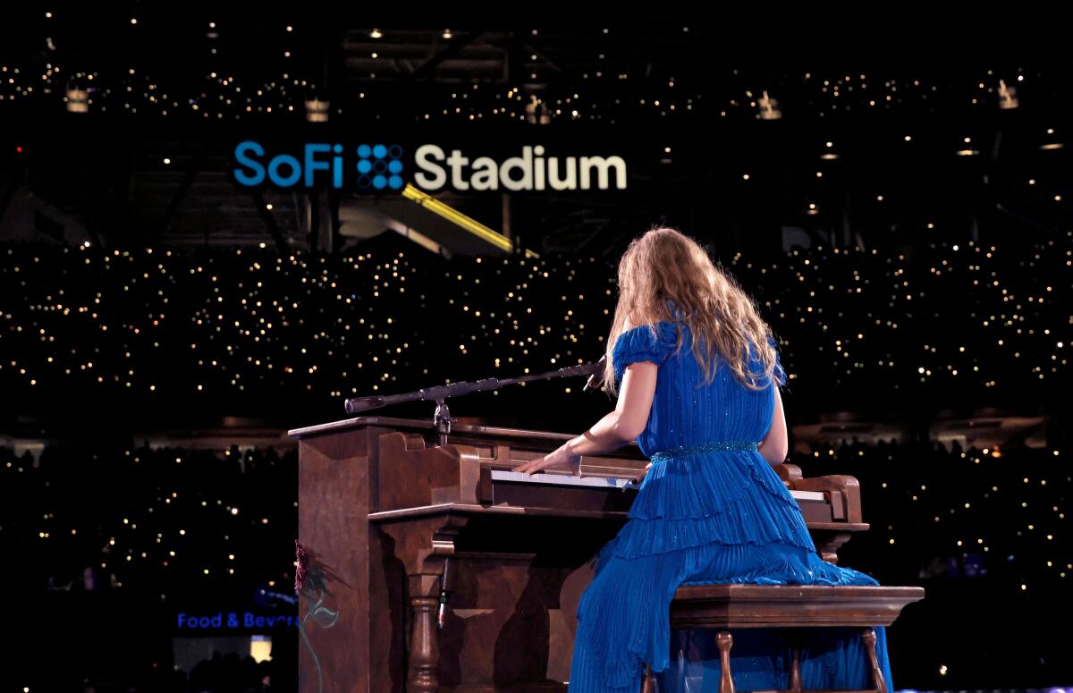 Taylor Swift plays piano at SoFi Stadium.