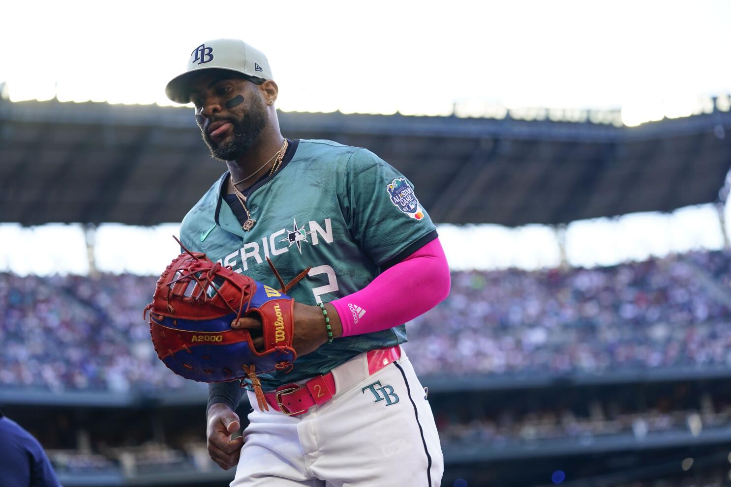 Tampa Bay Rays' Yandy Diaz wears a rainbow arm band as the Rays celebrate  Pride day during a baseball game against the Texas Rangers Saturday, June  10, 2023, in St. Petersburg, Fla. (