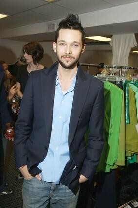 Designer Chris Benz poses backstage before his fall 2009 fashion show in New York.